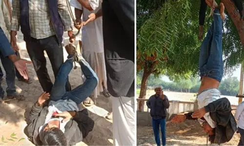 ദലിത് യുവാവിനെ മരത്തില് കെട്ടിത്തൂക്കിയിട്ട് മര്ദ്ദിച്ചു (വീഡിയോ) ദലിത് യുവാവിനെ മരത്തില് കെട്ടിത്തൂക്കിയിട്ട് മര്ദ്ദിച്ചു (വീഡിയോ)