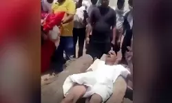മരിച്ച മാതാവിന്റെ ആഭരണങ്ങള്‍ തനിക്കുവേണം; ചിതയില്‍ കിടന്ന് പ്രതിഷേധിച്ച് ഇളയമകന്‍(വിഡിയോ)