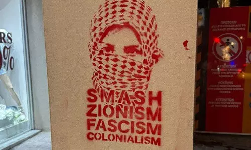 ഏഥന്സിലെ സയണിസ്റ്റ് വിരുദ്ധ ഗ്രഫിറ്റി നീക്കണമെന്ന് ഇസ്രായേല്; കുട്ടികളെ കൊല്ലുന്നവര് ക്ലാസെടുക്കരുതെന്ന് മേയര് ഏഥന്സിലെ സയണിസ്റ്റ് വിരുദ്ധ ഗ്രഫിറ്റി നീക്കണമെന്ന് ഇസ്രായേല്; കുട്ടികളെ കൊല്ലുന്നവര് ക്ലാസെടുക്കരുതെന്ന് മേയര്